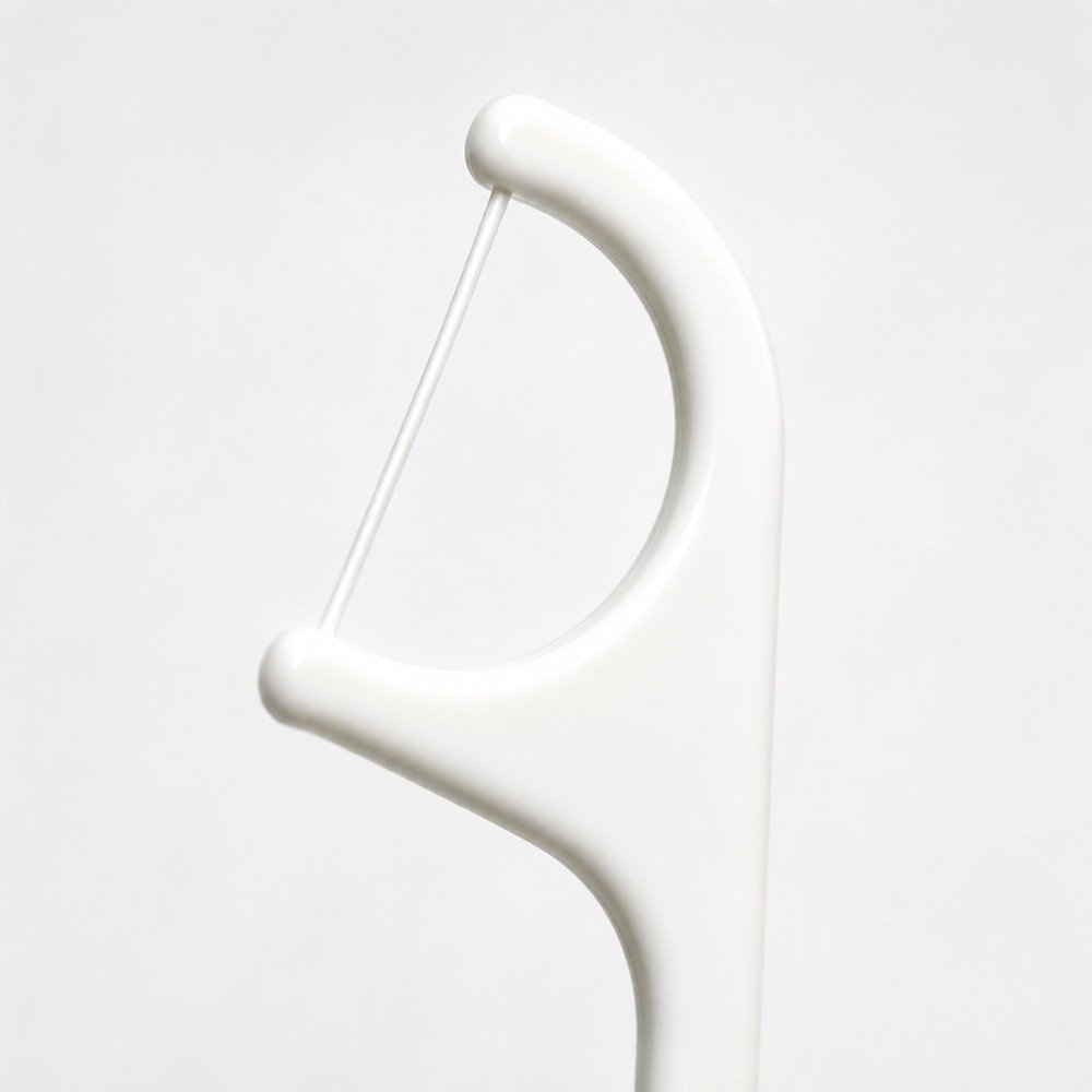 Adult Dental Floss Pick A1 - Classic Curved Handle - close-up detail